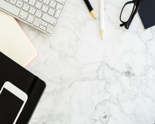 A well lit minimal desk setup showing a comfortable workspace